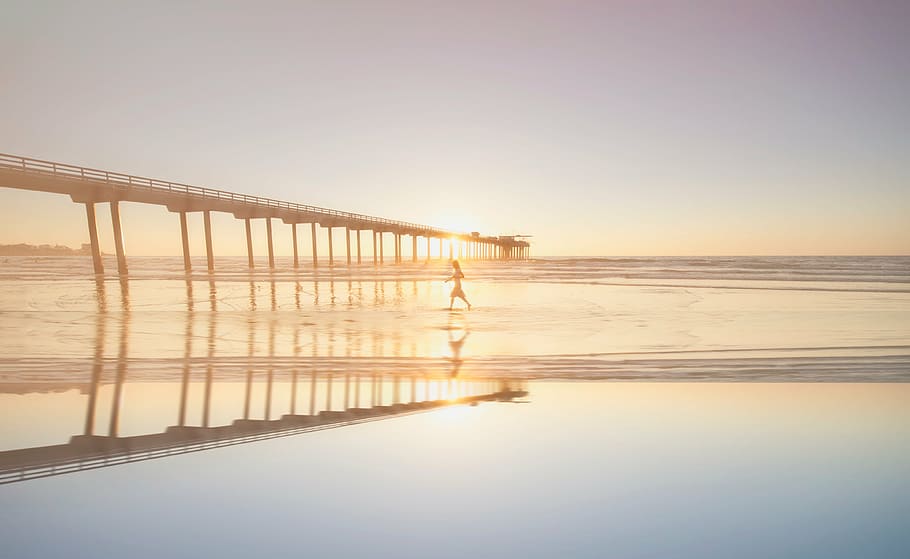 person, walking, shallow, water, bridge, golden, hour, silhouette, near, sea