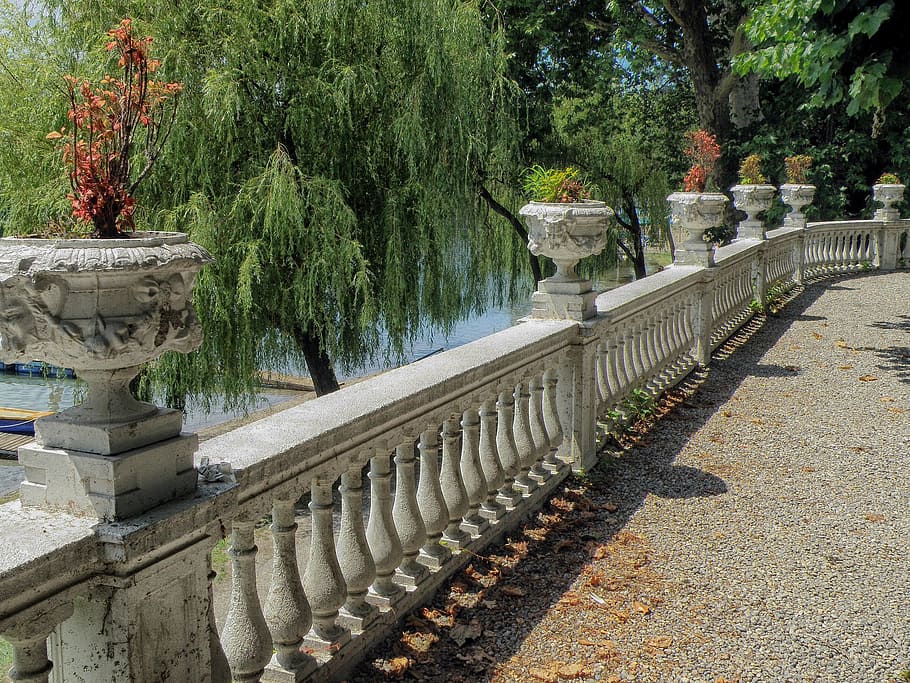 gray concrete baluster, sesto calende, italy, patio, railing, walkway, trees, plants, flowers, urns