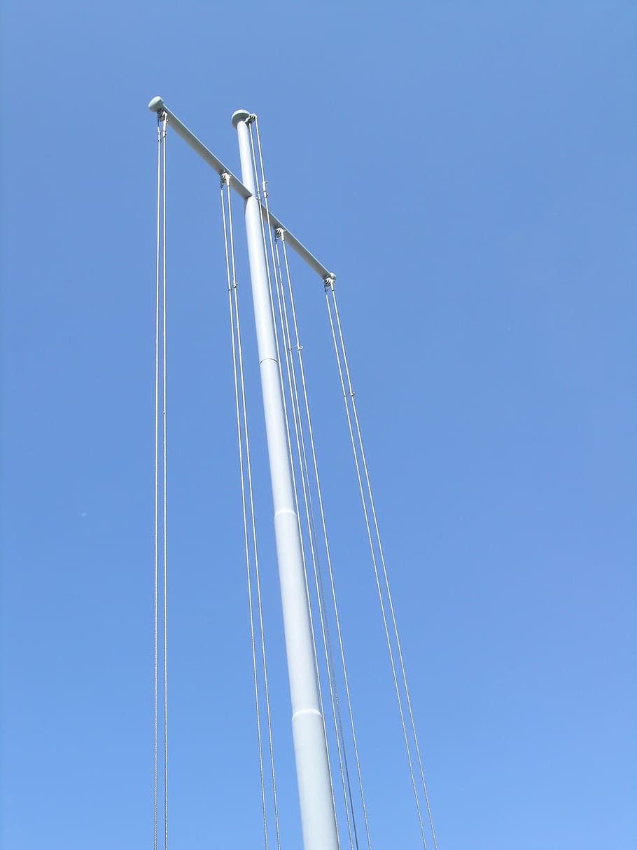 cross, auction, metal pole, structure for sailing, sky, low angle view, clear sky, blue, copy space, day