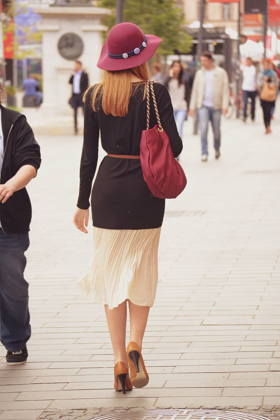 woman, wearing, black, white, long-sleeved, dress, lady walking on the street, walking away, elegant woman, stylish
