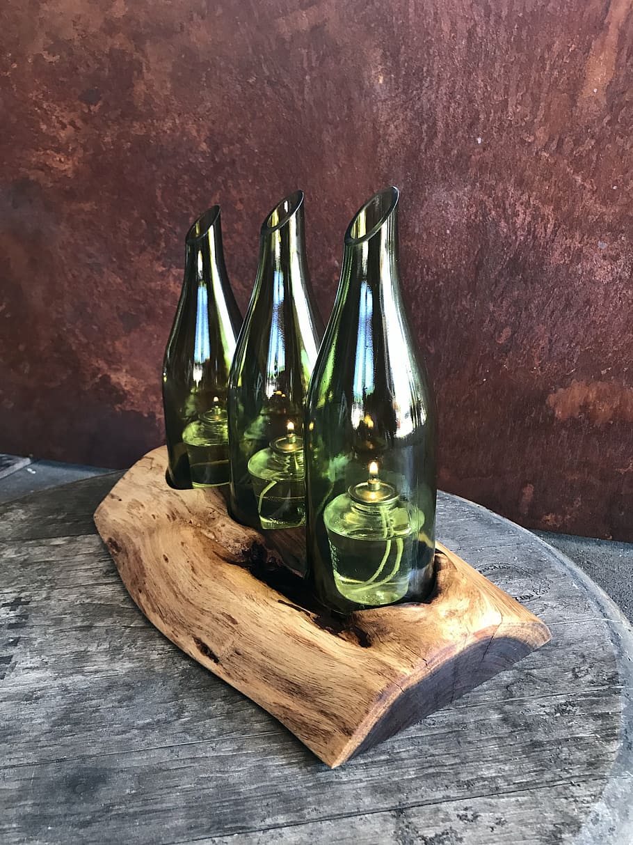 centerpiece, mesquite wood, plank wood, wine bottle, candle holder, table, bottle, container, still life, wood - material