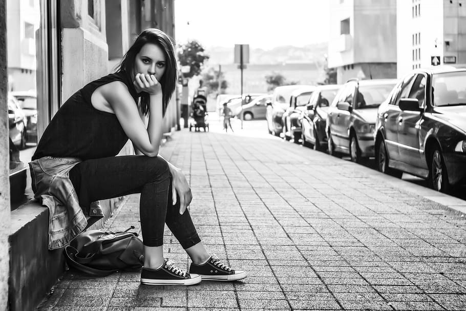 black and white, woman, girl, alone, sitting, waiting, street, car, vehicle, parking