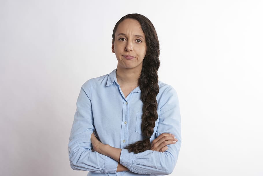 woman, wearing, teal dress shirt, Arms, Crossed, Person, Angry, annoyed, arms crossed, upset