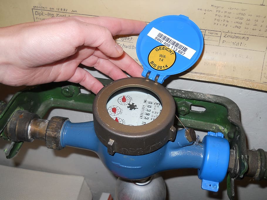 water meter reader, water retrieve, water clock, human hand, hand, human body part, one person, holding, close-up, fuel and power generation