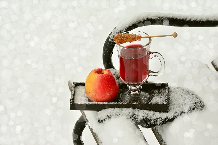 clear, glass footed mug, red, apple, black, wooden, ice, covered, tray, tee