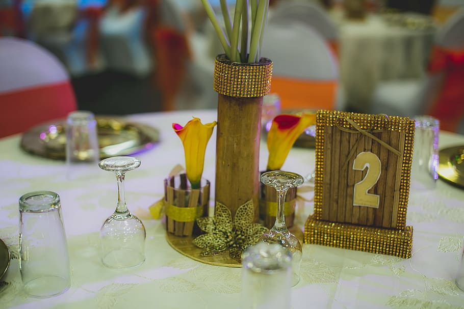 events, traditional, nigeria, african, center piece, bamboo, rafia, table setting, flowers, lilies