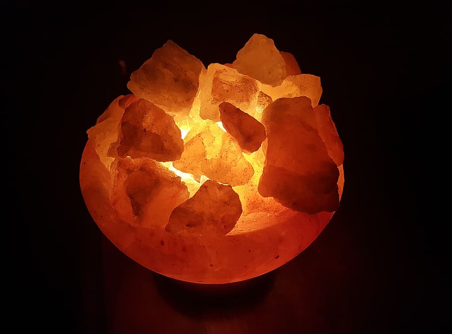 turned-on himalayan salt lamp, salt crystals, salt crystal lamp, crystals, stone, orange, health, wellness, mineral, ions