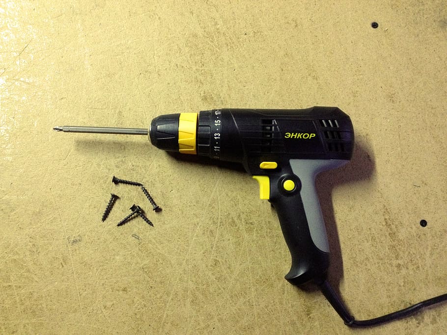 drill, screwdriver, black, on the table, table, tool, screws, yellow, still life, indoors