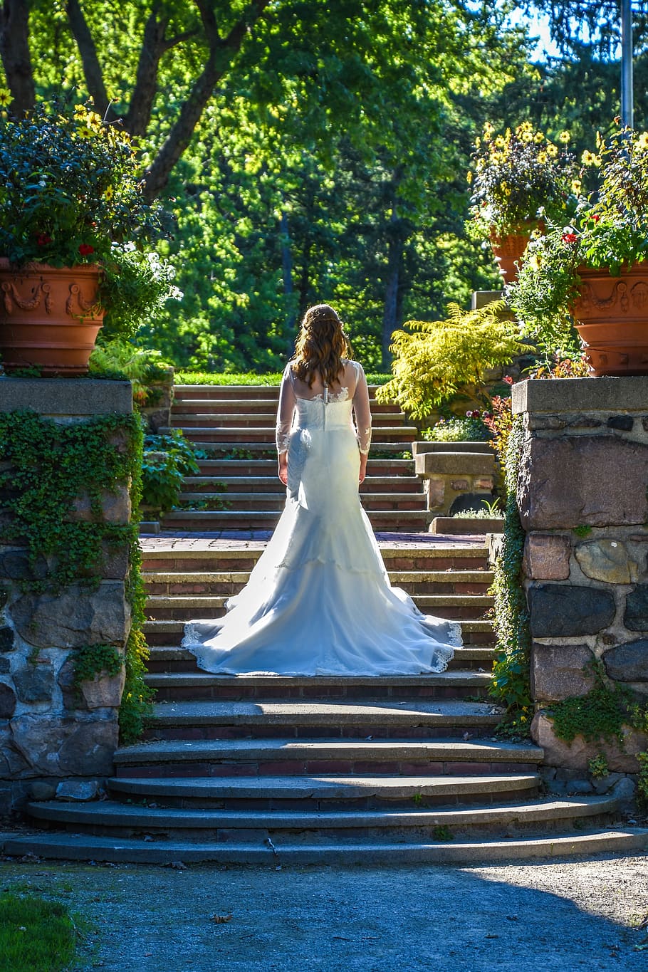 woman, wearing, wedding gown, walking, stairs, plants, daytime, stairway, garden, wedding