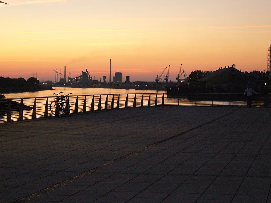 city, sunset, sky, afterglow, evening sky, river, bremen, architecture, water, built structure