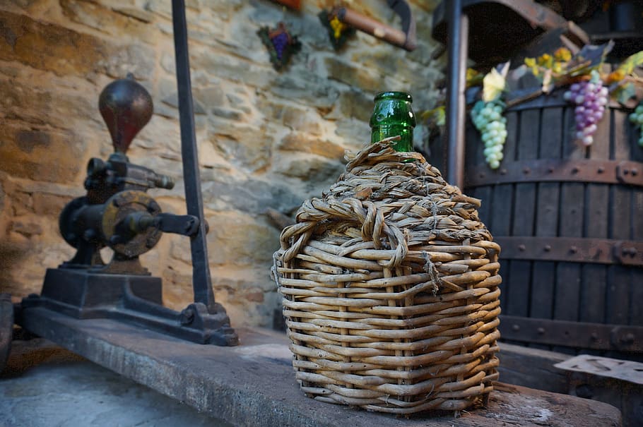 winepress, carboy, glass, architecture, focus on foreground, art and craft, basket, container, built structure, sculpture