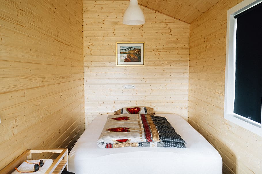 wood, log cabin, bed, sheets, pillow, frame, window, shades, light, covers