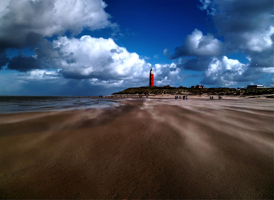 lighthouse near seashore, red, lighthouse, white, clouds, daytime, beach, sand, water, ocean