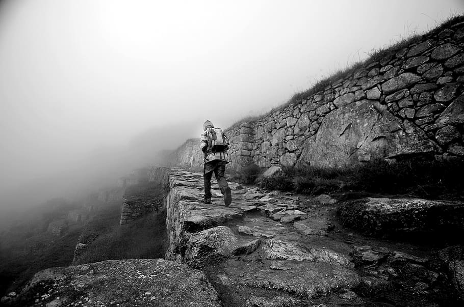 person, hiking, mountain grayscale photo, machu picchu, peru, cusco, stones, archeology, fog, leisure activity