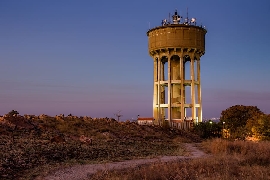 water tower, sunset, architecture, landscape, night, sky, built structure, tower, building exterior, nature