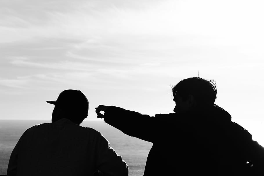 silhouette photography, two, men, facing, body, water, close, s, standing, near