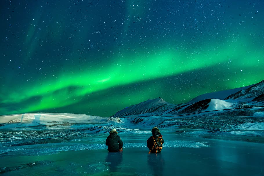 two, people, partially, submerged, water, surrounded, snow, overlooking, aurora borealis, aurora