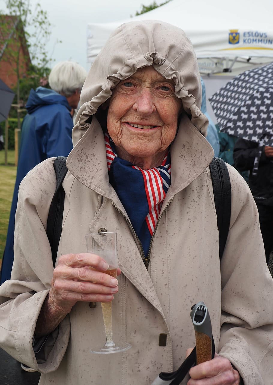 woman, rain, rain coat, bubbler, champagne, champagne glass, older, pensioner, senior Adult, people
