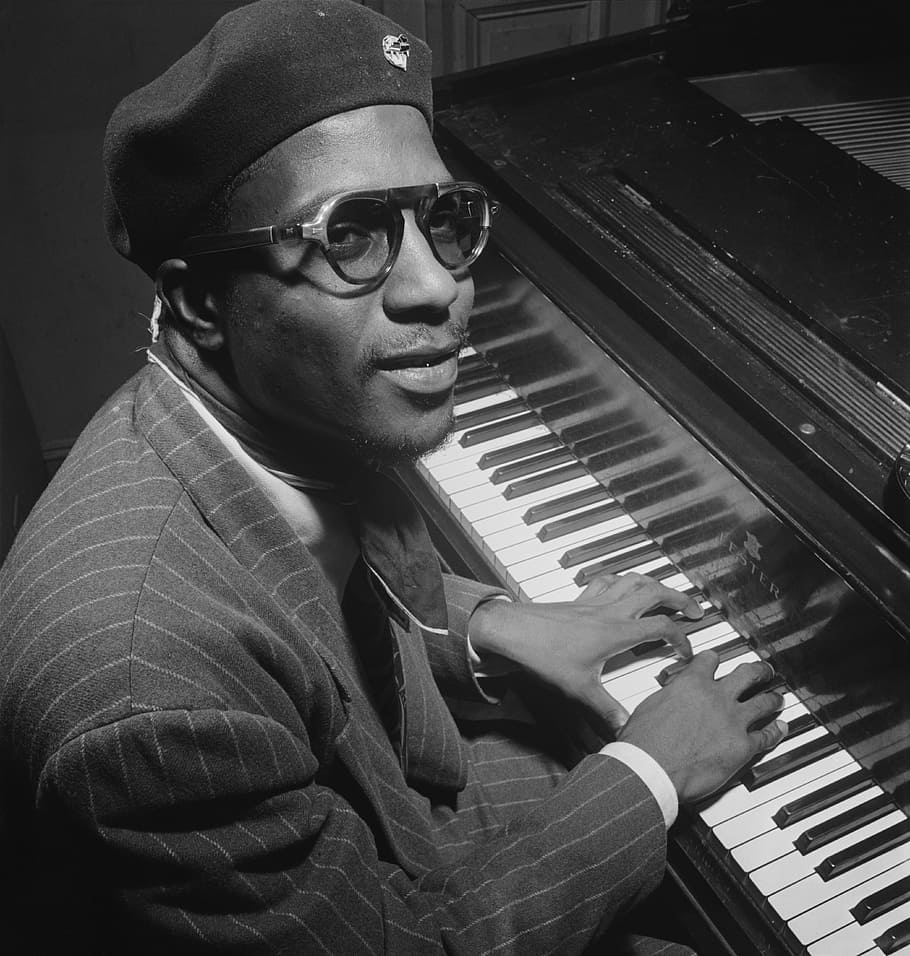 greyscale photo, man, playing, piano, inside, room, thelonious sphere monk, portrait, jazz pianist and composer, african american