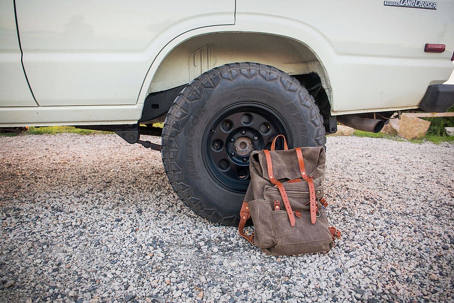 backpack, bag, outdoors, car, tire, wheel, hiking, equipment, explore, nature