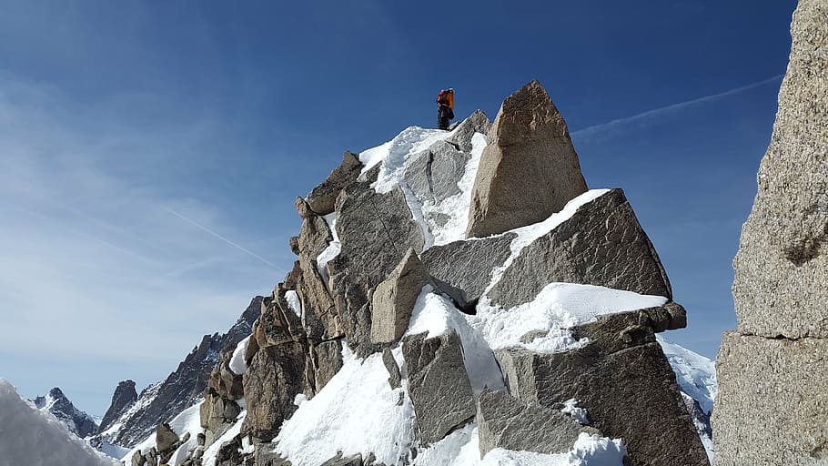 person, standing, black, monolith, covered, snow, cosmiques ridge, granite, summit, ridge