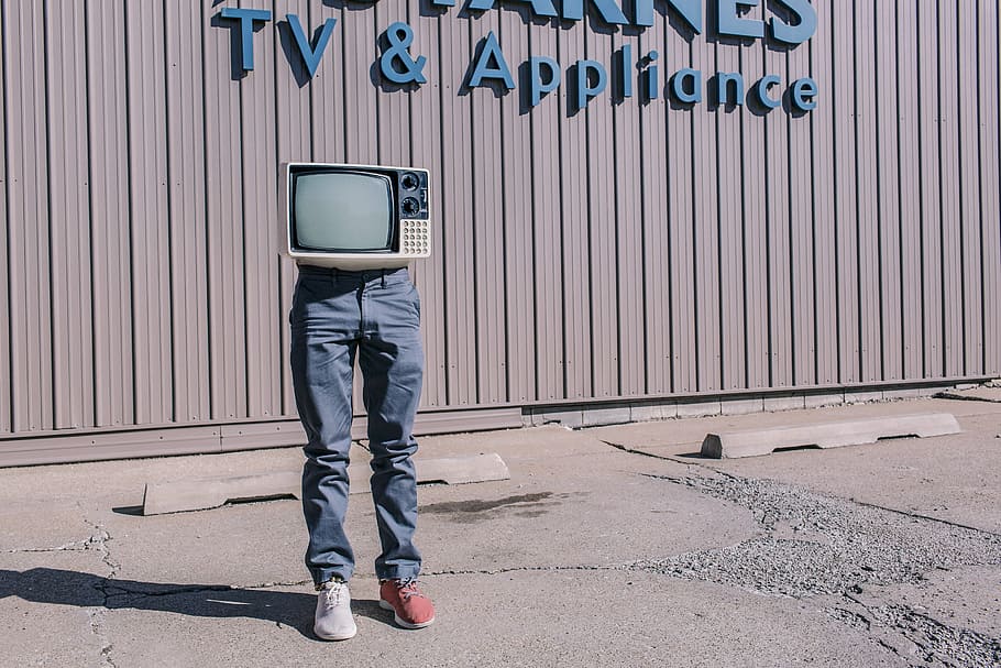 person, wearing, gray, denim jeans, white, red, sneakers, CRT television, red sneakers, people