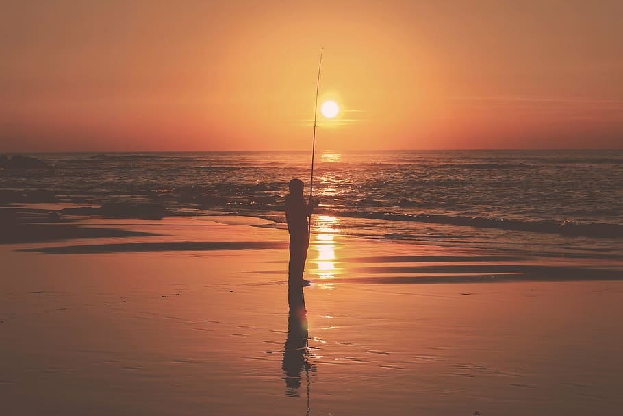 silhouette photo, person fishing, shore, dawn, sea, ocean, water, horizon, dark, sky