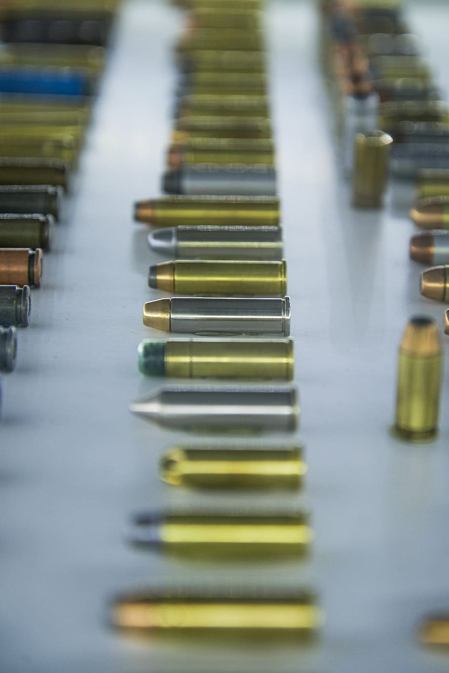 assorted-color bullet lot, gray, surface, bullet, gold, gun, metal, caliber, weapon, copper