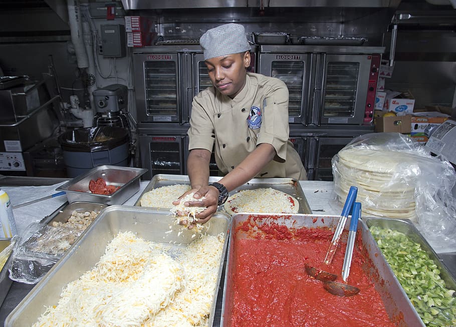 woman making food, kitchen, helper, table, preparation, preparing, pizza, sauce, occupation, food