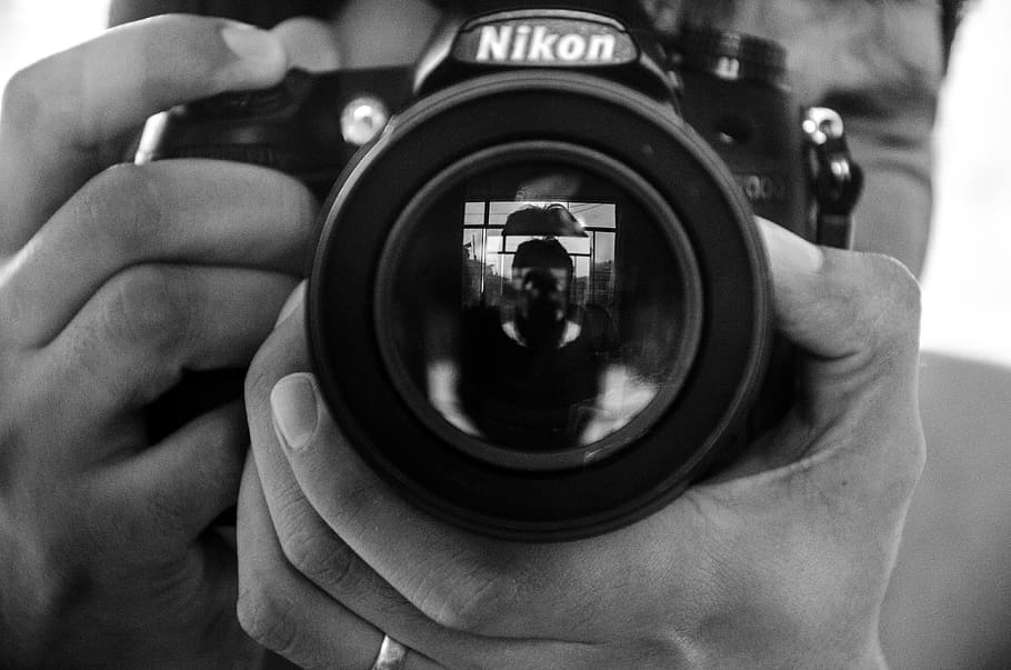 photographer, nikon, black and white, camera - photographic equipment, photographic equipment, human hand, camera, photographing, photography themes, digital camera