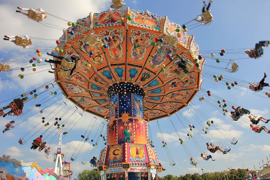 people, carnival, ride, daytime, sky, carousel, entertainment, travel, fair, pleasure