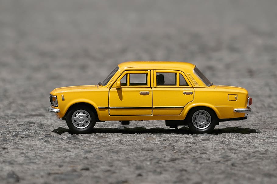 shallow, focus photography, yellow, taxi cab die-cast model, fiat, auto, vehicle, small car, antique car, classic car
