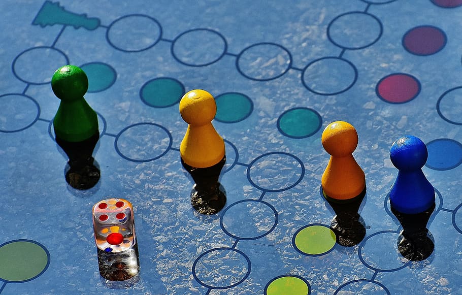 close-up photo, four, game board pieces, dice, not ludo, game board, glass, cone, game characters, cube