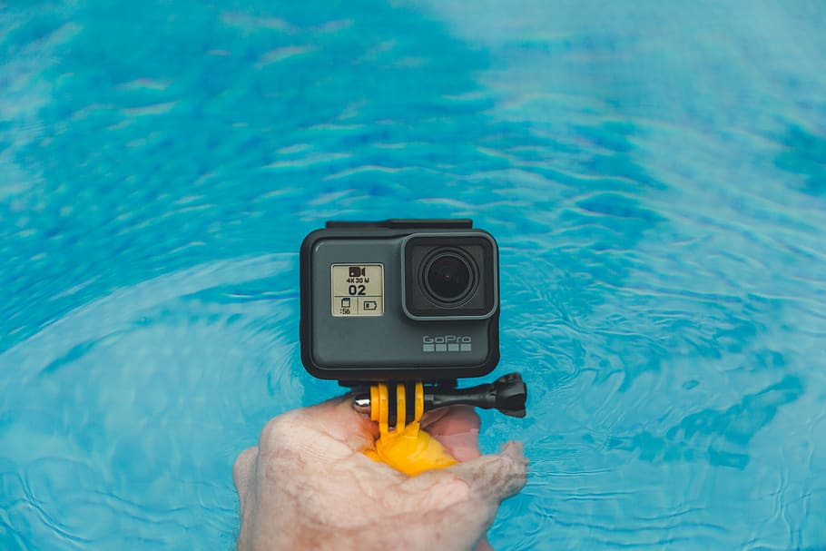 gopro, camera, photography, hand, swimming, pool, water, human hand, human body part, technology