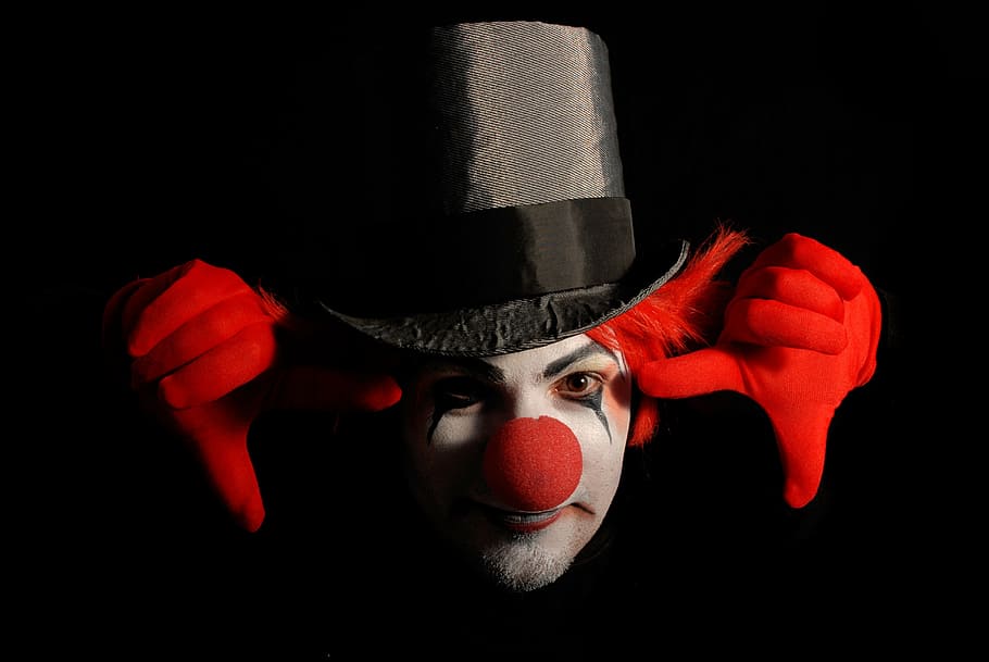 man, clown costume, color, clown, gloves, red, black background, studio shot, portrait, one person