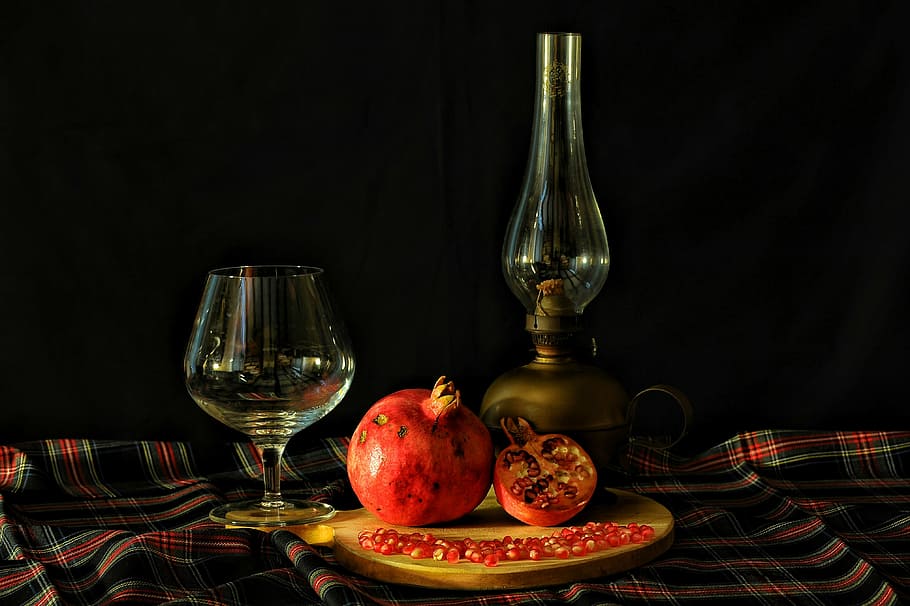 pomegranate, wine glass, oil lamp, table, glass, lamp, texture, scotland, black background, wineglass