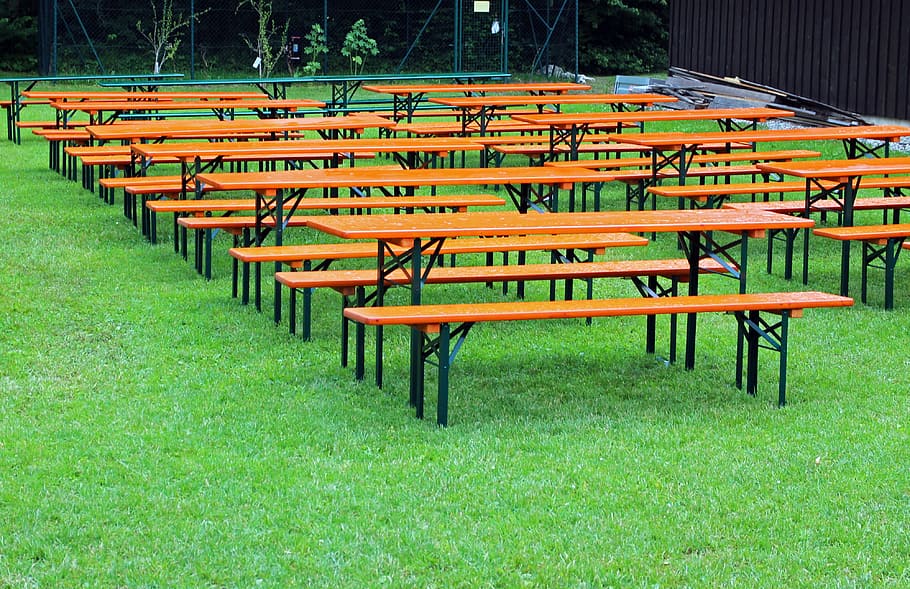 brown-and-black table, bench lot, grass field, seat, beer garden, seating, benches, dining tables, empty, beer accessories