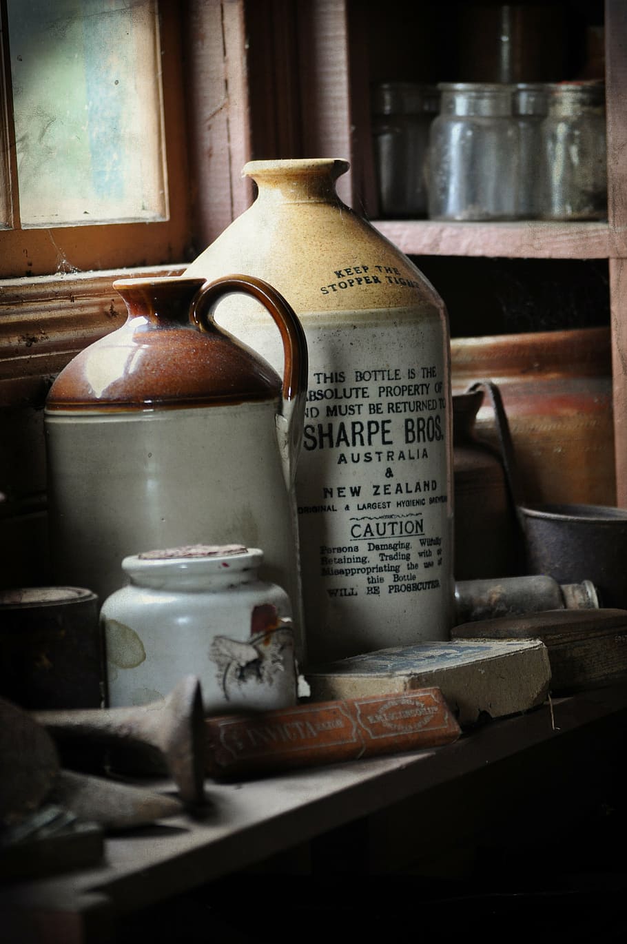 several, stoneware jugs, wooden, table, rack, old, bottle, window, dust, dusty