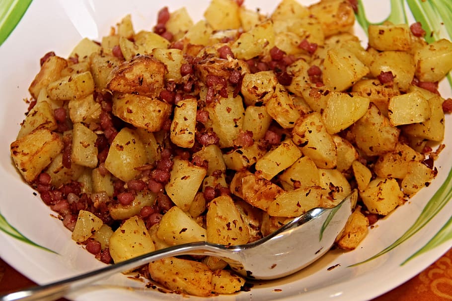 stainless, steel spoon, white, ceramic, bowl, fried potatoes, bacon, onions, potatoes, pieces
