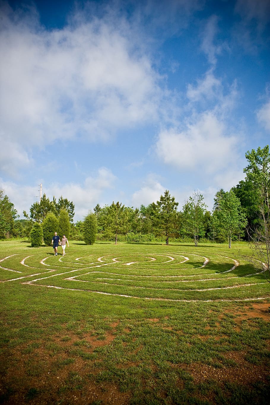 mandala, maze, labyrinth, outdoor, couple, walking, grass, green, sky, blue