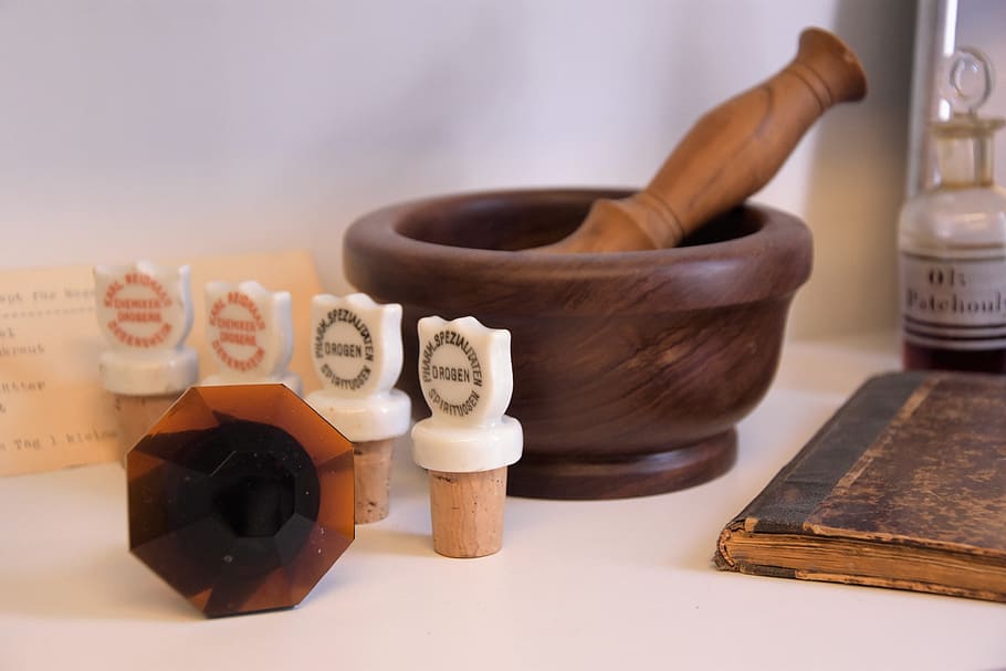 mortar, drugstore, cult, mortar and pestle, indoors, human body part, medicine, book, healthcare and medicine, calligraphy