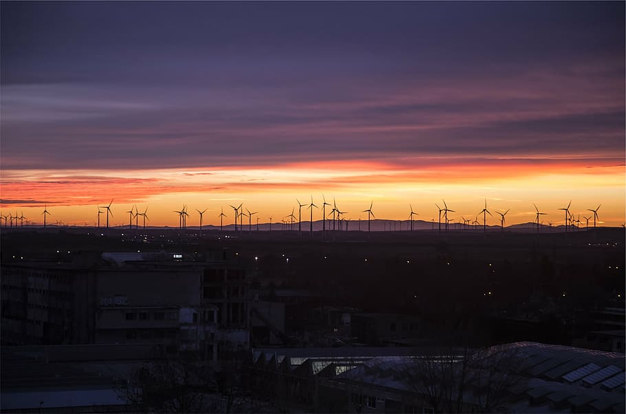 silhouette photo, wind turbine generator lot, far, windmills, houses, sunset, dusk, sky, night, dark