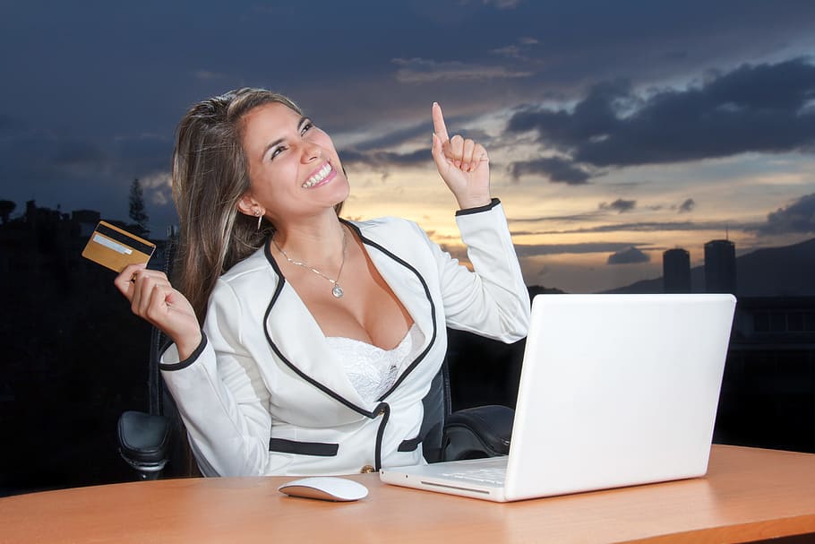 woman, white, black, blazer, smiling, sitting, business, attractive, corporate, online