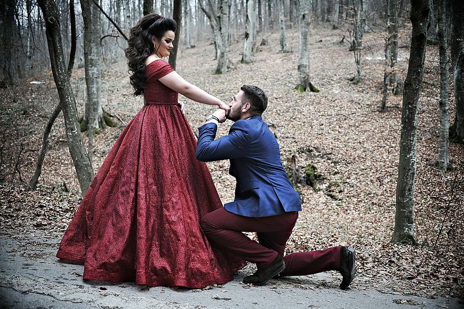 man, wears, blue, suit, women, red, dress, forest, proposing, engagement