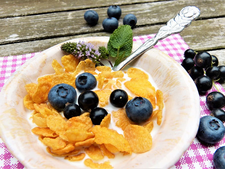 corn flakes, black, berries, cream, plate, placed, table, milk, blueberries, black currants