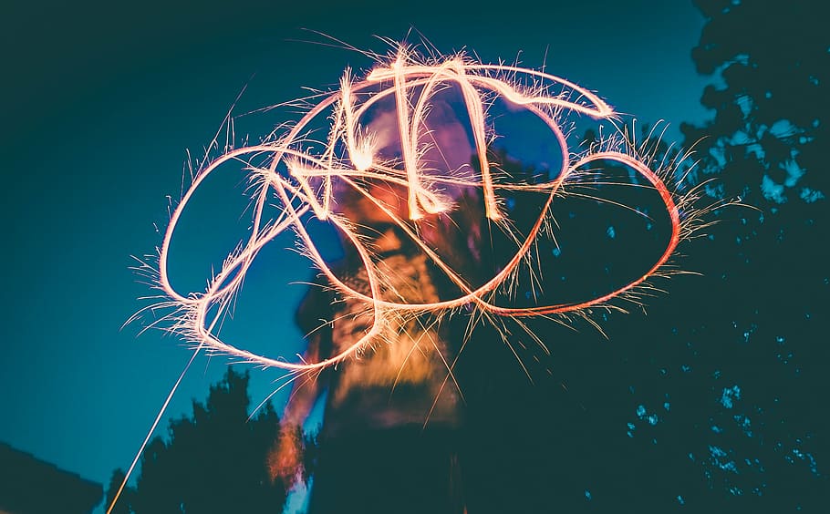 time-lapse photography, person, holding, sparkler, selective, focus, photography, lights, long, exposure
