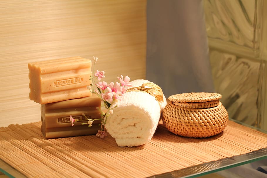 two, soap bars, white, face towel, brown, basket, wooden, table, soap, bars