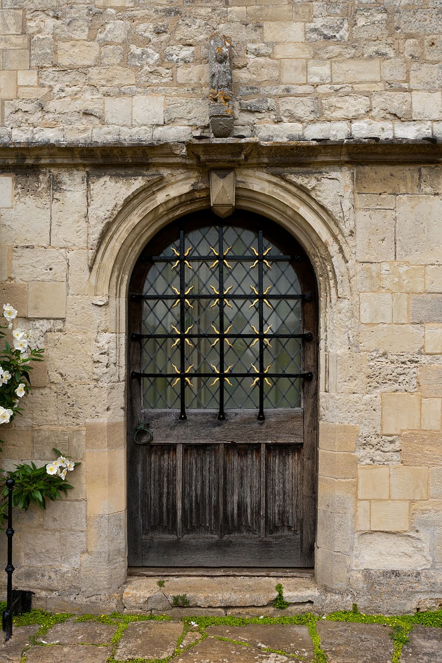 closed metal door, entrance, stonework, arch, angelsey abbey, cambridgeshire, architecture, historic, doorway, half glazed door