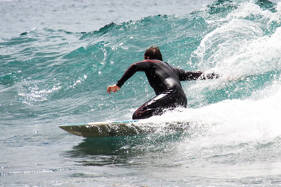 man riding surfboard, surfing, sport, beach, surf, board, surfboard, water, wave, fun