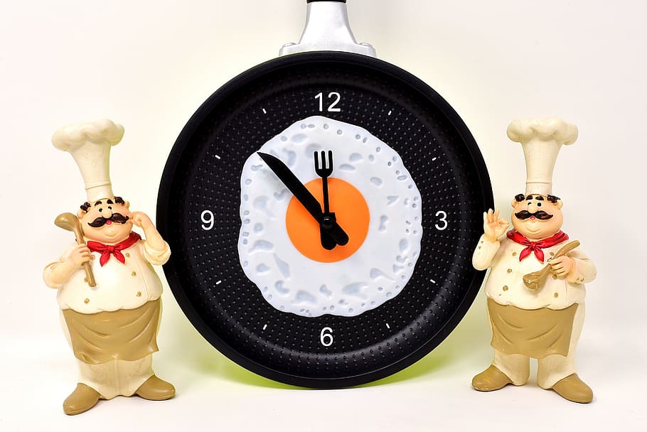 two, chef figurines, analog clock, displaying, 11:52, cooking, figure, funny, cook, time of